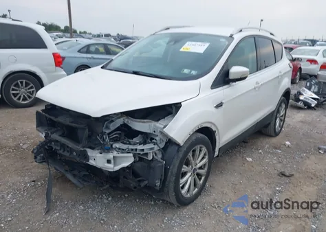 2017 Ford Escape Titanium z USA, uszkodzony, nr VIN 1FMCU9J96HUF09433
